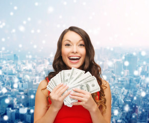 Woman holding a lot of money